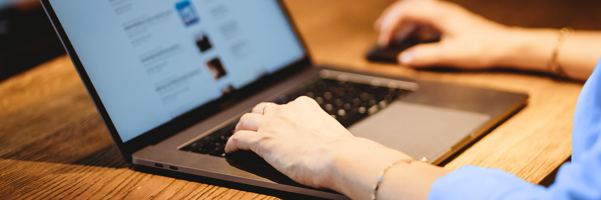 woman sitting at desk working on laptop