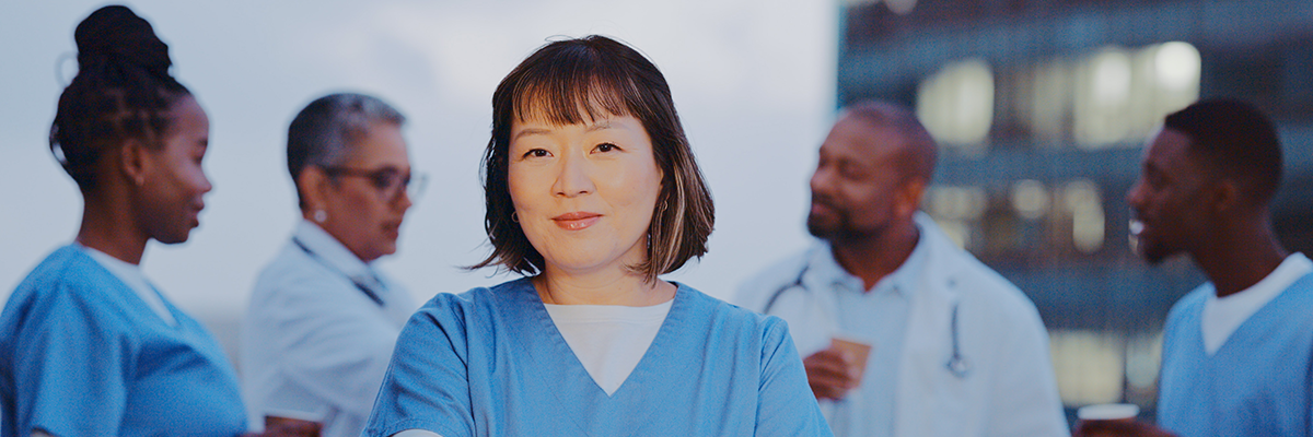 EVS woman standing in front of healthcare team 