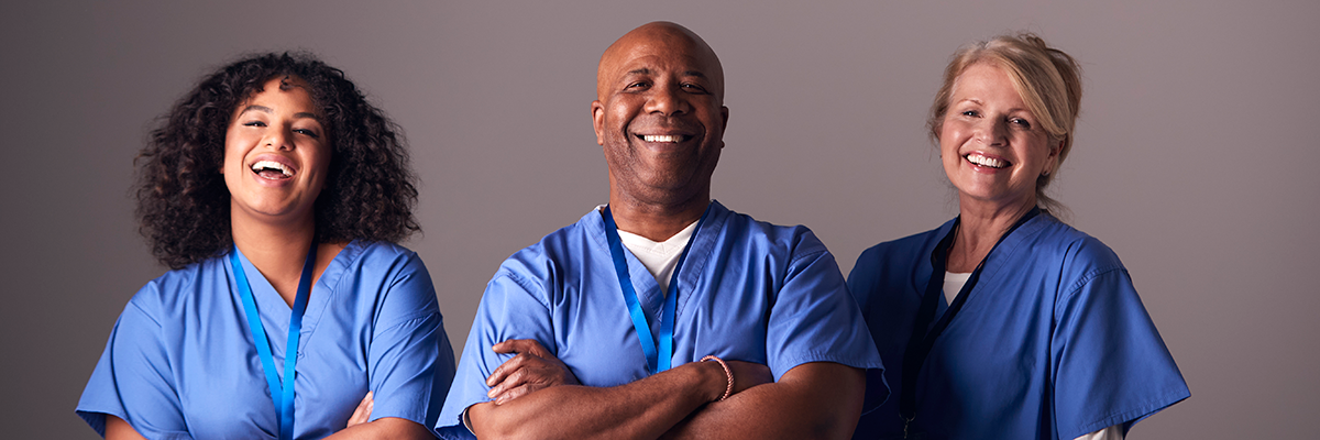 three EVS technicians smiling 