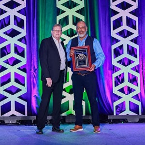 Rock D. Jensen is presented with the Phoenix Award
